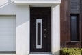 Entrance to the house with a dark armored door