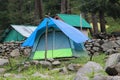 An entrance to a lush green Forest at Malana with Camps, Himachal Pradesh,