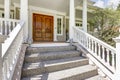 Entrance to a luxury country home with wrap-around deck. Royalty Free Stock Photo