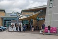 Entrance to motorway freeway services rest area showing building and customers Royalty Free Stock Photo