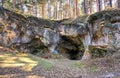 Entrance to a mysterious cave in the sandstone rock landscape in Blankenburg. Germany