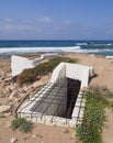 Entrance to an old abandoned concrete military bunker on the beach at paphos cyprus Royalty Free Stock Photo