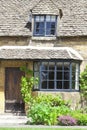 Entrance to old cottage with grape vine in English countryside Royalty Free Stock Photo