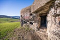 Entrance to the old destroyed World war ii bunker. Damaged reinforced concrete with protruding reinforcing wires. Wegierska Gorka