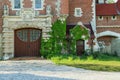 Historic castle, front side. entrance to the old house doors. Castle front with ivy. Royalty Free Stock Photo