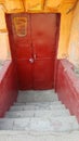 Entrance to old red door of historic building in European city Odessa of Ukraine Royalty Free Stock Photo