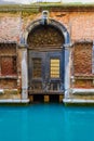 Entrance to an old Venetian house from a canal Italy Royalty Free Stock Photo