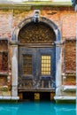 Entrance to an old Venetian house from a canal Italy Royalty Free Stock Photo