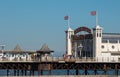 Entrance to Palace Pier on the Brighton UK sea front, showing the rides at the far end of the Pier including the helter skelter. Royalty Free Stock Photo