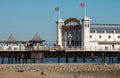 Entrance to Palace Pier on the Brighton UK sea front, showing the rides at the far end of the Pier including the helter skelter. Royalty Free Stock Photo