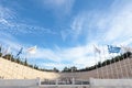 Entrance to the Panathenaic Stadium, with the Olympic flag and the Greek flag in front Royalty Free Stock Photo