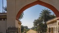 At the entrance to the park there is a metal lattice gate, an arched vault