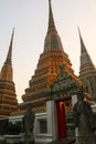 The entrance to Phra Chedi Rai with two guardians and three stupa. Royalty Free Stock Photo