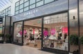 Entrance to Radley leather and handbag shop store showing window display, sign, signage, logo and branding