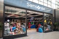 Entrance to Samsonite Luggage shop store showing window display, sign, signage, logo and branding