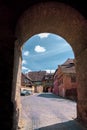 Entrance to Sighisoara citadel seen through the archway of the Tailors Tower Royalty Free Stock Photo