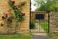 Entrance to a small garden next to an english stone cottage Royalty Free Stock Photo