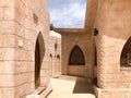 Entrance to the street, a lane with stone and buildings, the passage between the buildings in the Arab Islamic Islamic warm tropic Royalty Free Stock Photo