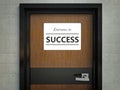 Entrance to success sign hanging on office door