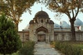 Entrance to the Suleymaniye Mosque in Istanbul (Turkey) - autumn garden - yellow trees in sunset - Islam religion