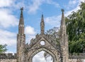 A stone gate way to Taymouth Castle with two small spires Royalty Free Stock Photo