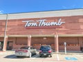 Entrance to Tom Thumb grocery store under cloud blue sky