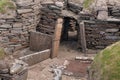 Entrance to underground dwelling at Skara Brae. Royalty Free Stock Photo