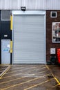 Entrance To A Warehouse Or Storage Unit Steel Shutter Down And Locked For Security With No People