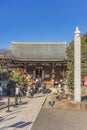 Entrance of the Togakuji temple with a commemorative Kuyo column on the right