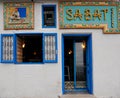 Entrance traditional Tunisian coffee bar, colourful tiles, blue door