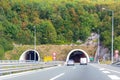 Entrance of tunnel in mountain of Croatia. Landscape with cars on highway and mountain forest with bright autumn foliage Royalty Free Stock Photo