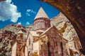 Entrance through tunnel to cave monastery Geghard, Armenia. Armenian architecture. Pilgrimage place. Religion background. Travel c Royalty Free Stock Photo