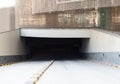 Entrance of the underground parking near the construction site of skyscraper made of bended sheets of welded wire mesh