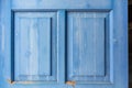 Entrance wooden door with blue shutters details Royalty Free Stock Photo