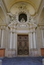 Entrance wooden door of the Church of Saint Mary of the Announcement/ Chiesa parrocchiale della Santissima Annunziata in Parma, It