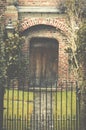 Entrance wooden door and metal gate of a traditional English man Royalty Free Stock Photo