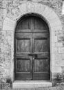 The entrance wooden door in an old Italian house. Royalty Free Stock Photo