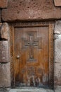 Entrance wooden doors to the church with a cross. Royalty Free Stock Photo