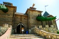 Entrance at wooden fortress with fabled towers. Family Ethnic Amusement Park Kudykina Gora