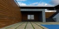 Entrance from the yard to a modern minimalist house. Finishing the porch with concrete. The wall is lined with facade board.