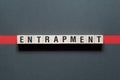 Entrapment word concept on cubes Royalty Free Stock Photo