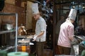 Entrepreneur hand separating cocoa beans for production while standing at a table in an artisanal chocolate making factory