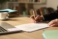 Entrepreneur hands signing contract in the night at home Royalty Free Stock Photo