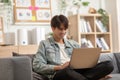 Entrepreneur handsome business asian man wear shirt sitting on couch working online with computer laptop smile happiness and relax Royalty Free Stock Photo