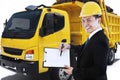 Entrepreneur holds clipboard with delivery truck Royalty Free Stock Photo