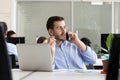 Entrepreneur making call consulting client speaking by cell in o Royalty Free Stock Photo