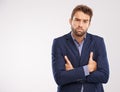 Entrepreneur, man and studio with arms crossed on white background with deadline and business concern. Portrait