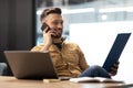 Entrepreneur Man Talking On Phone Holding File Binder In Office Royalty Free Stock Photo