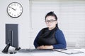 Entrepreneur sitting with computer on desk