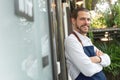 Bearded Man Business Owner with arms crossed standing at front of cafe Royalty Free Stock Photo